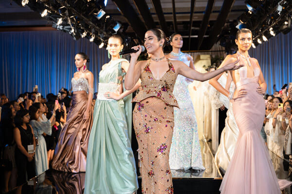 Jonita Gandhi on stage with the models.
