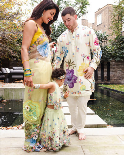 The family dressed in custom Rahul Mishra.