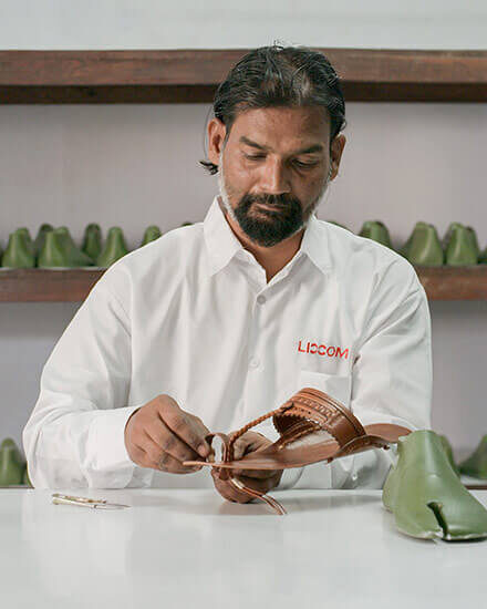 Artisans working on the Prada slippers