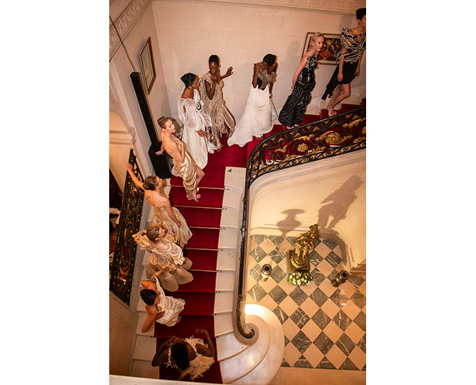 Vaishali's models descend the staircase at the Residence of the Ambassador of India to France.