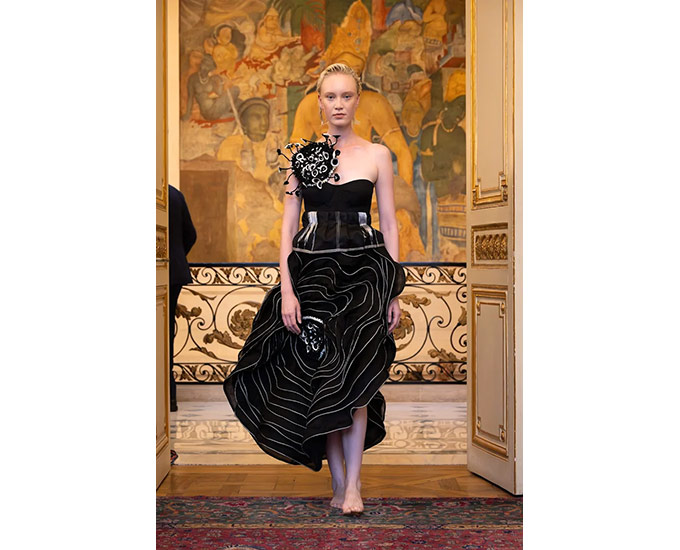 Flowers recurred across bodices, corsets and sculptural forms through the collection.