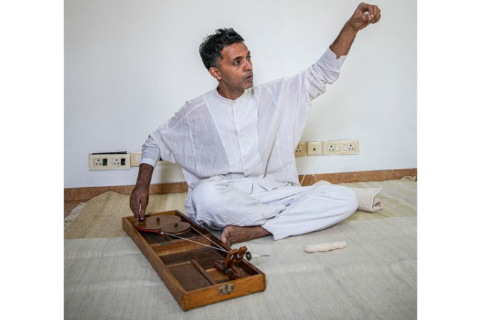 Shani Himanshu spinning yarn on a 'Peti Charkha'. Priyanka Parashar